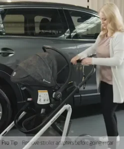 Mum pushing maxi cosi mico plus capsule attached to pram
