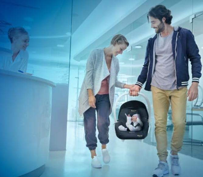 Mum n dad carrying baby in maxi cosicapsule